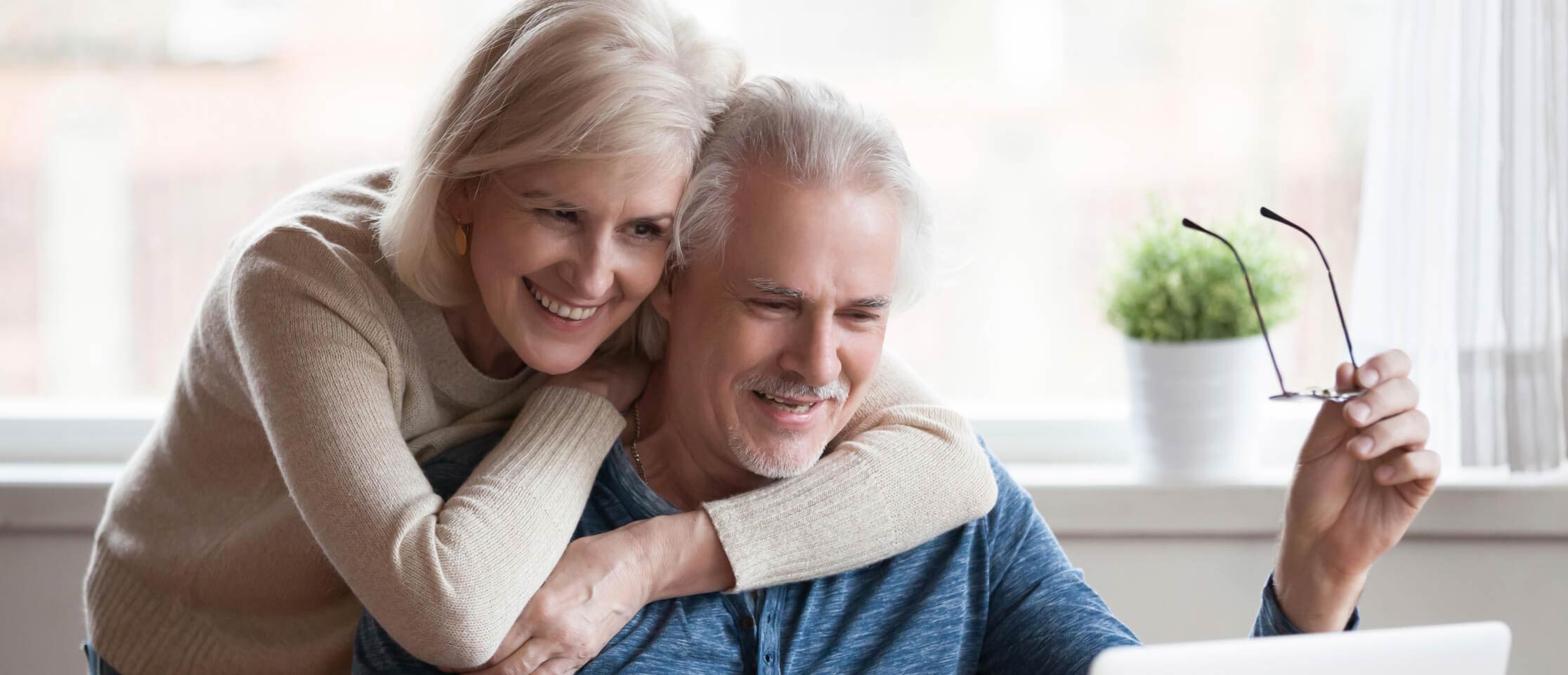 happy senior couple buying online