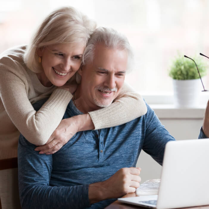 happy senior couple buying online