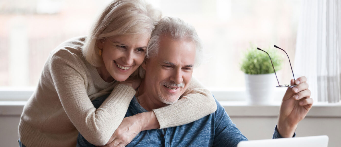 happy senior couple buying online